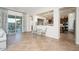 Open-concept living room with seamless access to kitchen and outdoor patio at 7157 E Ivyglen Cir, Mesa, AZ 85207