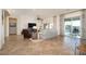 Spacious living room featuring tile floors, a ceiling fan, and sliding glass doors to the pool at 7157 E Ivyglen Cir, Mesa, AZ 85207