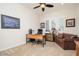 Comfortable office space with natural light, a desk, and a seating area at 7157 E Ivyglen Cir, Mesa, AZ 85207