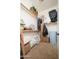 Walk-in closet with shelves, hanging rods, and ample storage space at 7157 E Ivyglen Cir, Mesa, AZ 85207