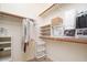 Organized walk-in closet with ample storage shelves and hanging space at 7157 E Ivyglen Cir, Mesa, AZ 85207
