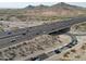 Aerial shot capturing bustling highway with vehicles, mountains, and desert landscape at 750 E Northern Ave # 1079, Phoenix, AZ 85020
