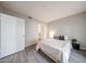 Bright bedroom with ensuite bathroom, wood floors, neutral walls and white trim at 750 E Northern Ave # 1079, Phoenix, AZ 85020