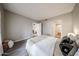 Bright primary bedroom with neutral walls and views to the ensuite and sitting room at 750 E Northern Ave # 1079, Phoenix, AZ 85020