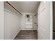 Walk-in closet with built in shelves and clothes rods at 750 E Northern Ave # 1079, Phoenix, AZ 85020