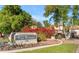 Well maintained Las Brisas Condominium community sign surrounded by lush landscaping at 750 E Northern Ave # 1079, Phoenix, AZ 85020