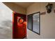 Inviting front door featuring a wreath, sidelight window, and unit number at 750 E Northern Ave # 1079, Phoenix, AZ 85020