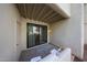 View of the covered patio with a sliding glass door leading to the home at 750 E Northern Ave # 1079, Phoenix, AZ 85020