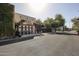 Restaurant exterior showing ivy growing up a building, a bench, trees, and a paved parking area at 750 E Northern Ave # 1079, Phoenix, AZ 85020