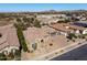 Suburban home with manicured yard, red tiled roof, and mountain views at 7576 W Quail Ave, Glendale, AZ 85308