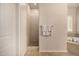 Bright bathroom featuring a walk-in shower, soaking tub and towel rack at 7576 W Quail Ave, Glendale, AZ 85308