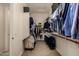 Walk-in closet featuring ample hanging space and built-in shelving for organization at 7576 W Quail Ave, Glendale, AZ 85308