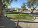 A well-manicured community green space with seating and walking paths for residents to enjoy at 7576 W Quail Ave, Glendale, AZ 85308