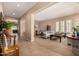 Open-concept living room featuring neutral walls, carpet, and comfortable seating at 7576 W Quail Ave, Glendale, AZ 85308