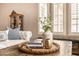 Living room detail with plantation shutters, stylish decor, and comfortable seating for a relaxing ambiance at 7576 W Quail Ave, Glendale, AZ 85308