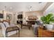 Open concept living room with comfortable seating, large windows and ceiling fan at 7576 W Quail Ave, Glendale, AZ 85308