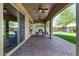 Covered patio area with paver flooring, ceiling fans and a grill at 7576 W Quail Ave, Glendale, AZ 85308