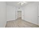 Light-filled bedroom with a ceiling fan, wood-look floors, and an airy ambiance at 7887 N 16Th St # 130, Phoenix, AZ 85020