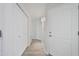 Bright hallway featuring wood-style floors and white doors, creating a clean and inviting entrance at 7887 N 16Th St # 130, Phoenix, AZ 85020