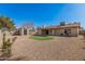 Backyard showcasing desert landscaping, a storage shed, and a well-maintained exterior at 836 W Watson Dr, Tempe, AZ 85283