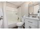 Bright bathroom with a shower-tub combo, modern white vanity and gray accents at 836 W Watson Dr, Tempe, AZ 85283