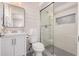 Modern bathroom featuring shiplap walls, updated vanity, and a walk-in shower with stylish tile accents at 836 W Watson Dr, Tempe, AZ 85283