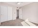 Neutral toned bedroom with carpet flooring, closet space, and modern ceiling fan at 836 W Watson Dr, Tempe, AZ 85283