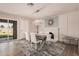 Charming dining room featuring a decorative fireplace, stylish lighting, and convenient access to the yard at 836 W Watson Dr, Tempe, AZ 85283