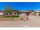 Single-story home boasts low-maintenance desert landscaping and a neat, grassy area in the front yard at 836 W Watson Dr, Tempe, AZ 85283