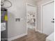 Laundry area with wood tile floors, and access to other rooms in the house at 836 W Watson Dr, Tempe, AZ 85283