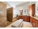 This gorgeous bathroom is complete with a walk-in shower, soaking tub, and vanity at 9098 N 117Th Way, Scottsdale, AZ 85259