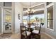 Charming breakfast nook with large windows overlooking the landscaped backyard and pool at 9098 N 117Th Way, Scottsdale, AZ 85259