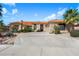 Charming single-story home with a red tile roof, desert landscaping and a spacious driveway at 9098 N 117Th Way, Scottsdale, AZ 85259