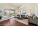 Inviting living room with hardwood floors, stylish furniture, and natural light through large windows at 9098 N 117Th Way, Scottsdale, AZ 85259