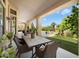 The patio is perfect for dining and overlooks the grassy yard and large swimming pool at 9098 N 117Th Way, Scottsdale, AZ 85259