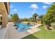 Sparkling pool and spa surrounded by lush greenery and mature trees at 9098 N 117Th Way, Scottsdale, AZ 85259