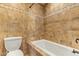 Bathroom with a tiled walk-in shower, toilet, and a jacuzzi bathtub at 9121 W Quail W Trl, Queen Creek, AZ 85144