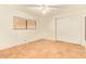 Bright bedroom with a ceiling fan, window, and a closet with white sliding doors at 9121 W Quail W Trl, Queen Creek, AZ 85144