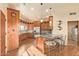 Open concept kitchen with an island, bar seating, and pendant lighting at 9121 W Quail W Trl, Queen Creek, AZ 85144