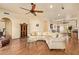 Spacious living room with hardwood floors, natural light and an open floor plan at 9121 W Quail W Trl, Queen Creek, AZ 85144