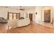 Open concept living room with beautiful floors, an arched doorway, and backyard access at 9121 W Quail W Trl, Queen Creek, AZ 85144