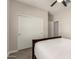 Bright bedroom featuring a ceiling fan and closet with paneled sliding doors at 101 W Seven Seas Dr, Casa Grande, AZ 85122