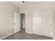 This bedroom features an open doorway and closet with bright paneled sliding doors at 101 W Seven Seas Dr, Casa Grande, AZ 85122