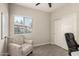 Office space with a comfortable chair and a window overlooking backyard at 101 W Seven Seas Dr, Casa Grande, AZ 85122