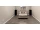 A chair with an ottoman, two speakers, and window make this space comfortable at 101 W Seven Seas Dr, Casa Grande, AZ 85122