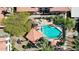 Aerial view highlights the inviting community pool with covered lounge area, surrounded by lush landscaping at 10224 N 12Th Pl # 1, Phoenix, AZ 85020
