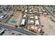 Scenic aerial view of a community with red-tiled roofs, amenities like a pool and tennis court, surrounded by landscape at 10224 N 12Th Pl # 1, Phoenix, AZ 85020