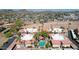 Aerial view features a condo complex, common pool area, desert landscaping, and mountain views at 10224 N 12Th Pl # 1, Phoenix, AZ 85020