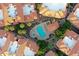 An aerial view displays the community pool surrounded by trees and terracotta-roofed buildings at 10224 N 12Th Pl # 1, Phoenix, AZ 85020