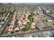 Expansive aerial view of a neighborhood featuring red-tiled roofs, lush landscaping, and mountain views at 10224 N 12Th Pl # 1, Phoenix, AZ 85020